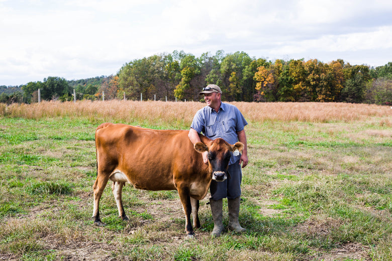 Farmer with cow